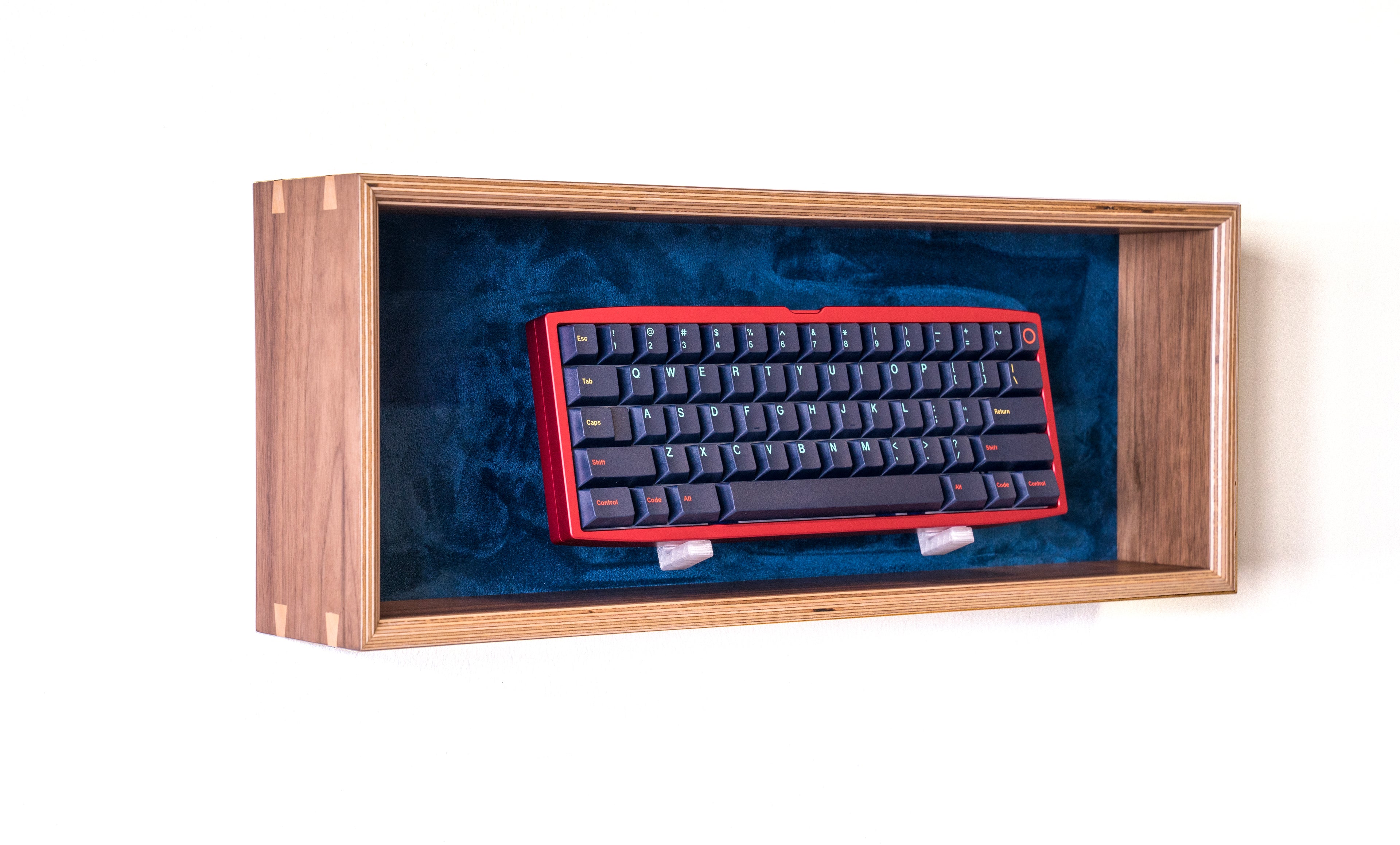 side view of walnut and navy display box for mechanical keyboards