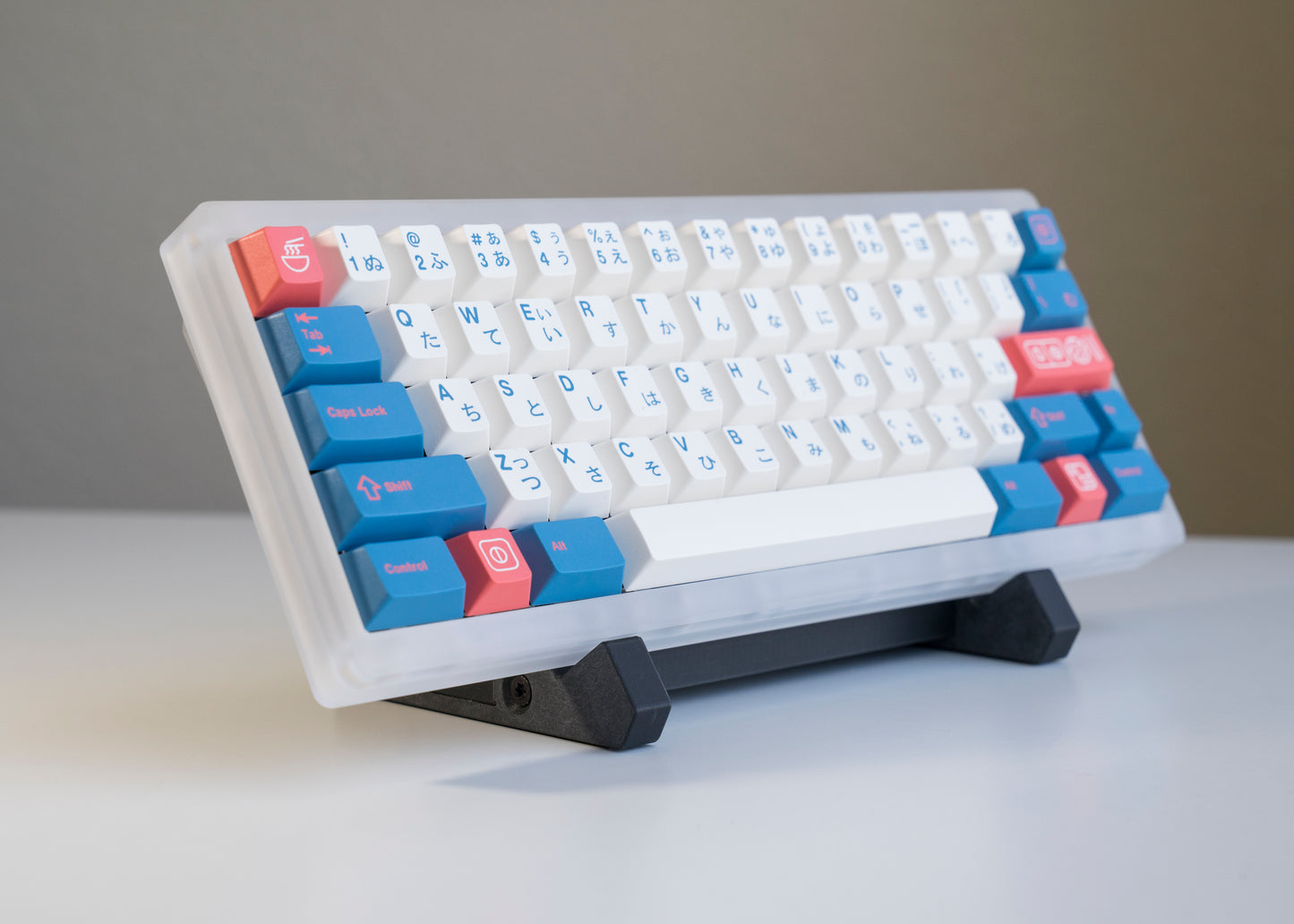 front of of black 3D printed PLA keyboard stand with silicone padding for mechanical keyboards with prop keyboard