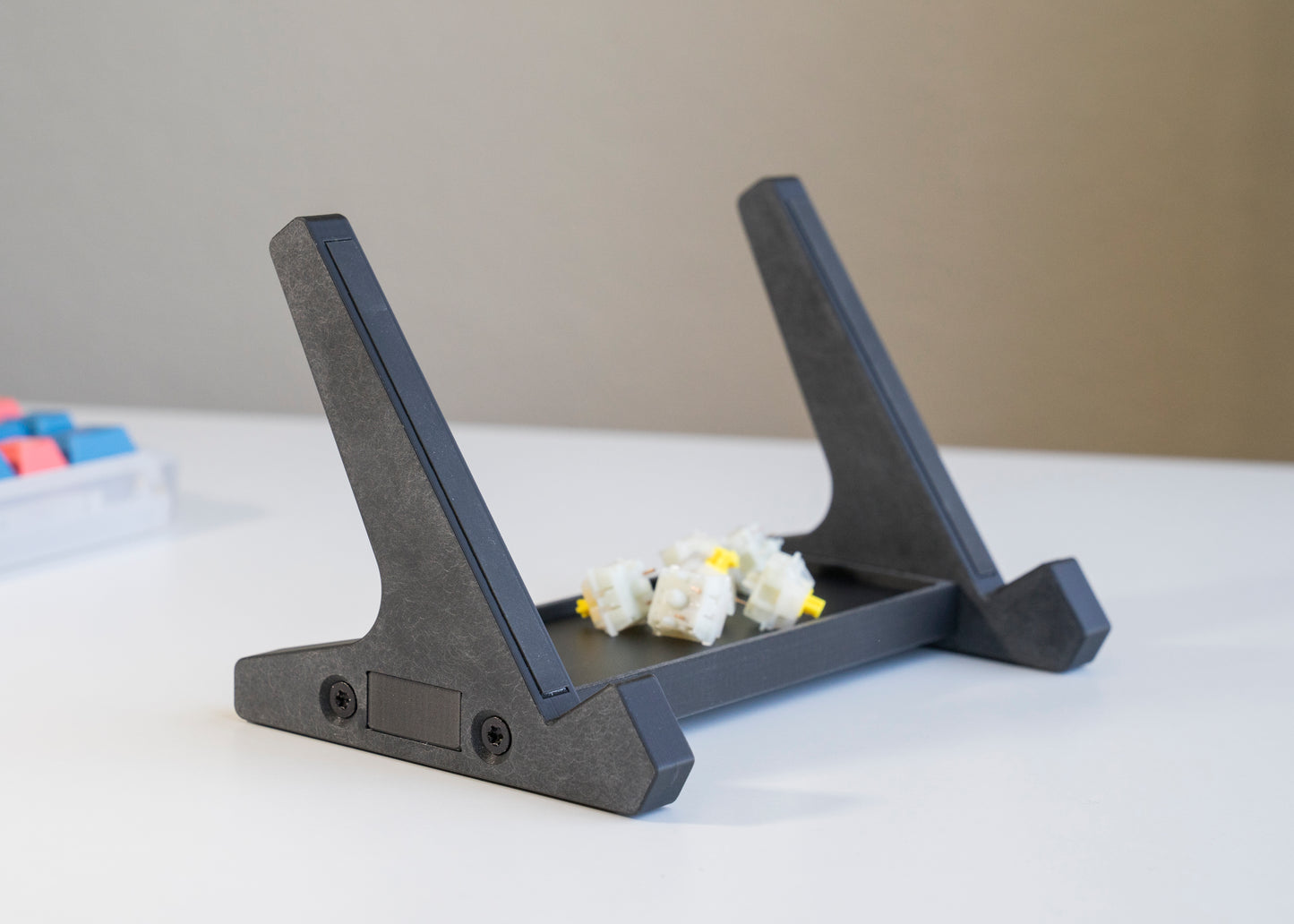 front of of black 3D printed PLA keyboard stand with silicone padding for mechanical keyboards