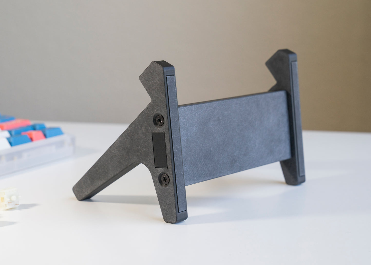 bottom of black 3D printed PLA keyboard stand with silicone padding for mechanical keyboards