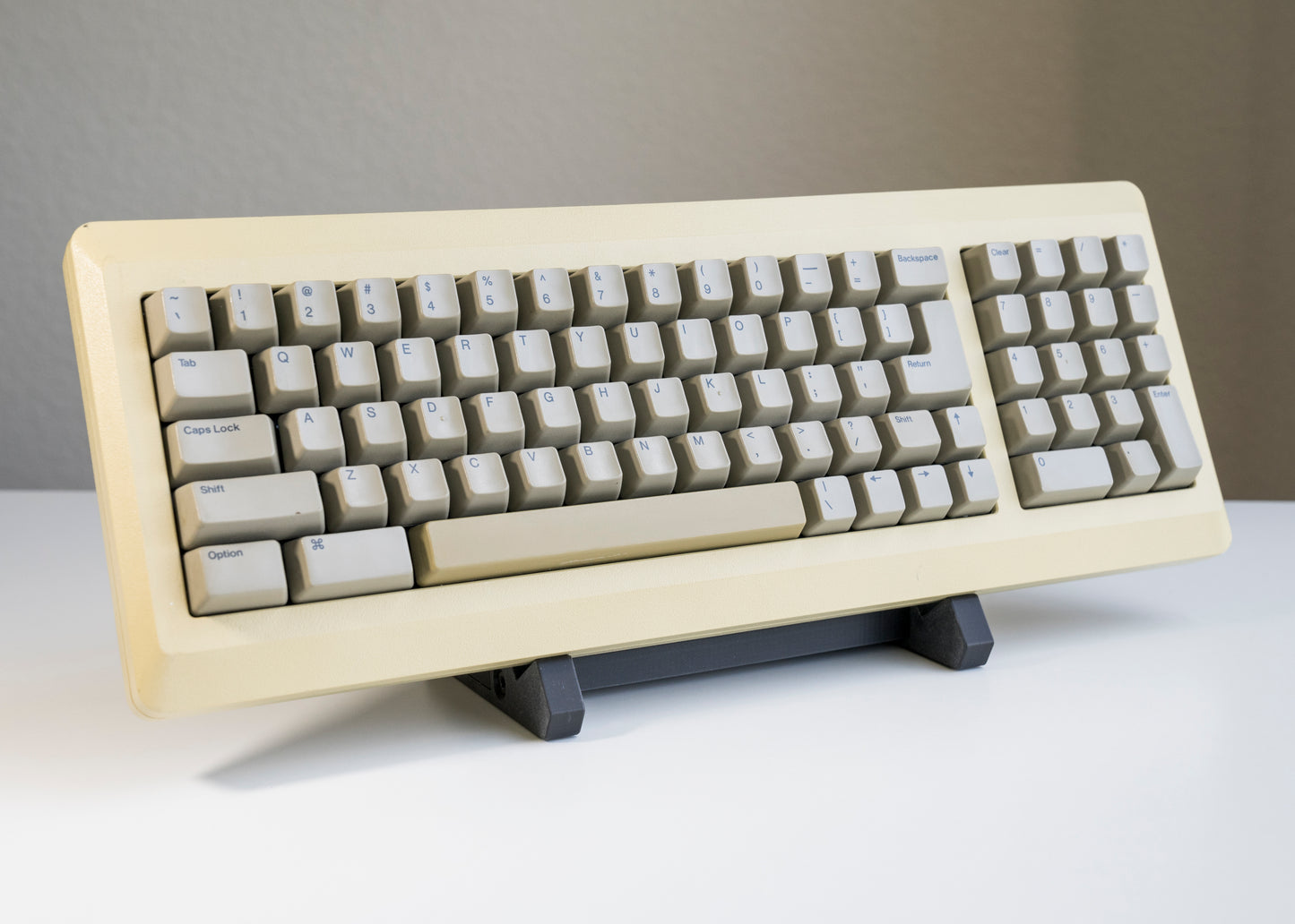 front of of black 3D printed PLA keyboard stand with silicone padding for mechanical keyboards with large keyboard