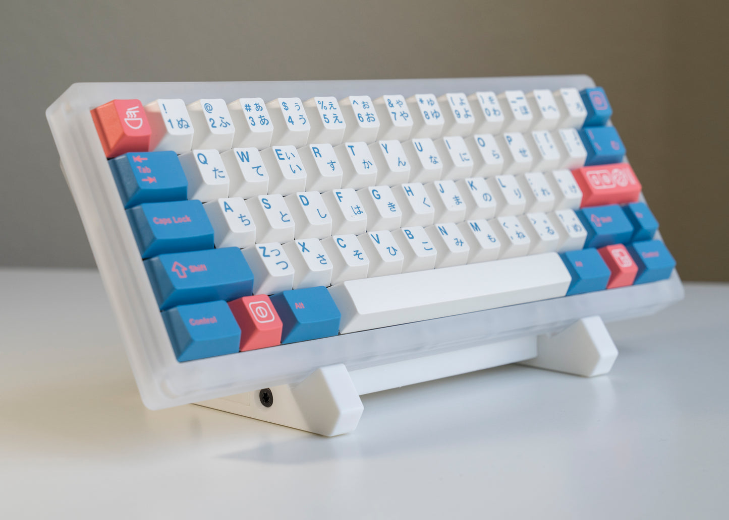 front of of white 3D printed PLA keyboard stand with silicone padding for mechanical keyboards with prop keyboard