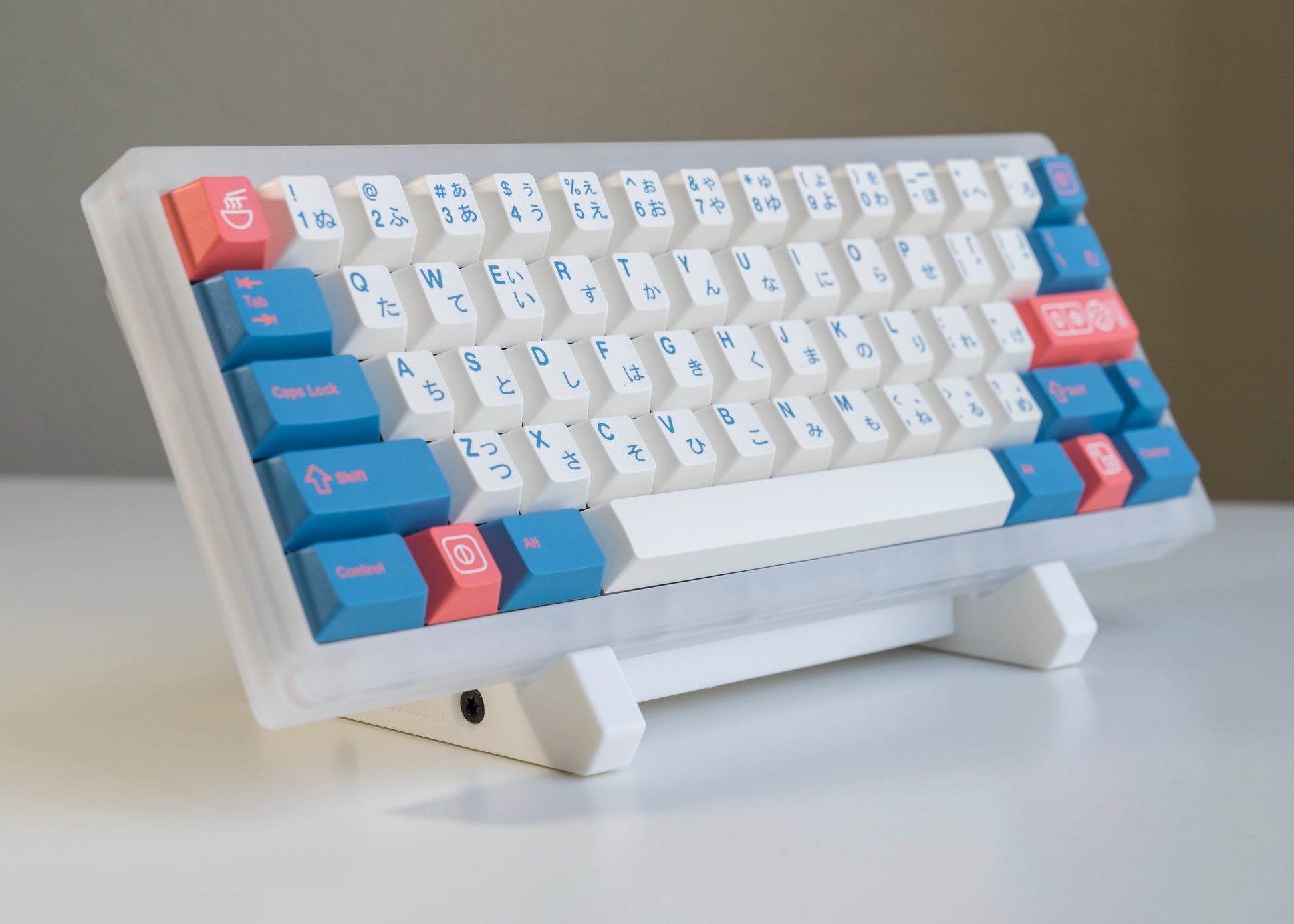 front of of white 3D printed PLA keyboard stand with silicone padding for mechanical keyboards with prop keyboard