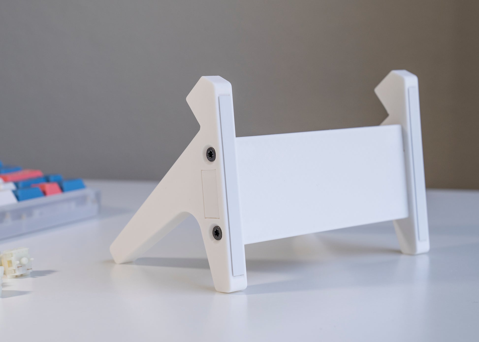 Bottom of white 3D printed PLA keyboard stand with silicone padding for mechanical keyboards