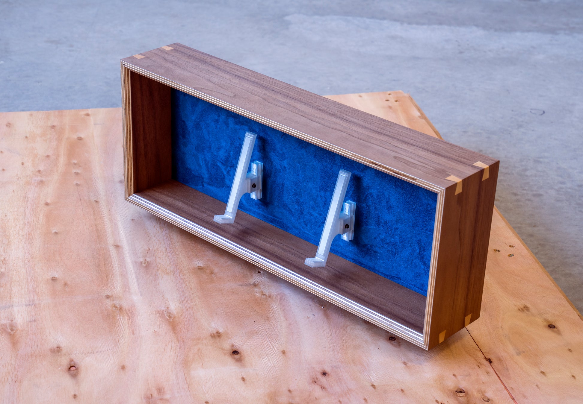 top view of walnut and navy display box for mechanical keyboards